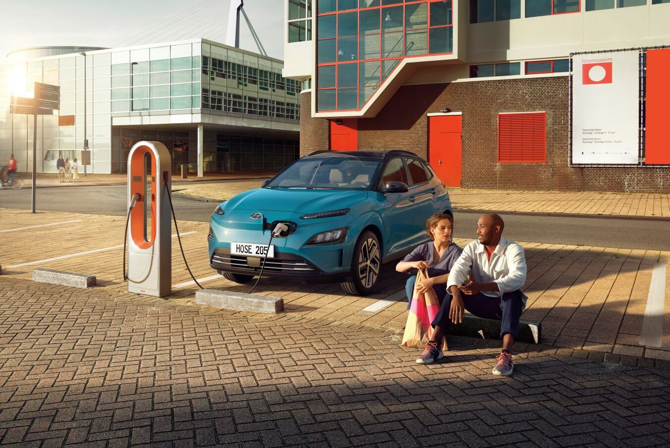 Hyundai KONA Electric recharging at a charging station