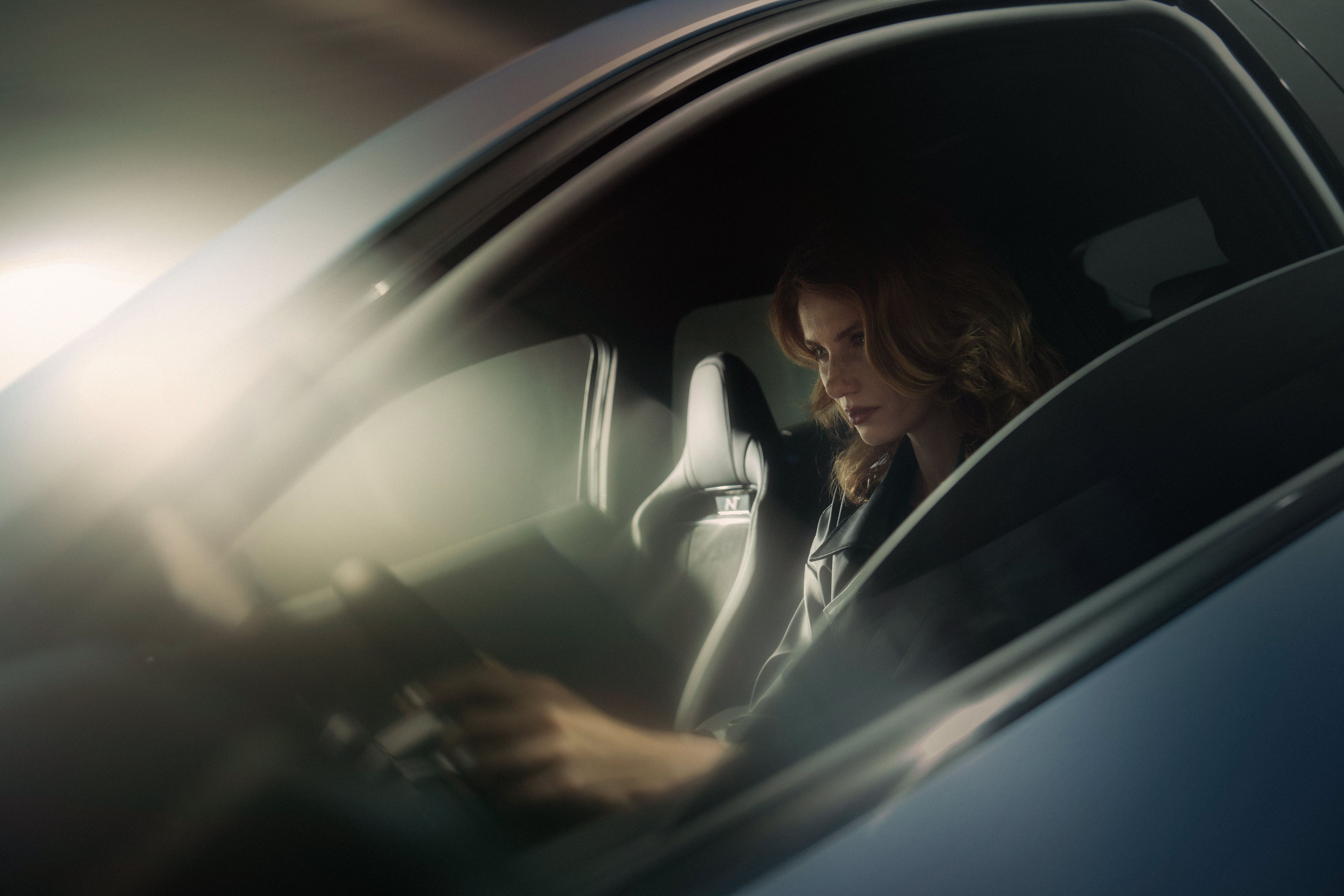 A woman driving the all-electric Hyundai IONIQ 5 N.