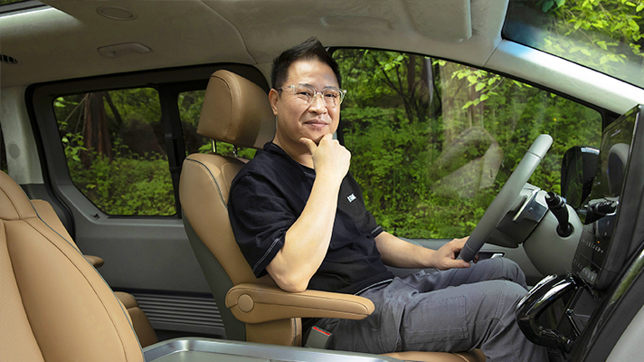 Senior researcher Jink-Hyuk Seo in Hyundai Staria driver's seat